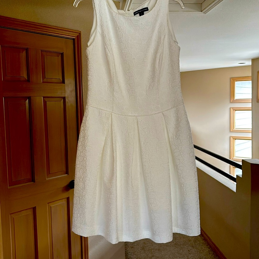 Beautiful fitted dress with flare at waist.